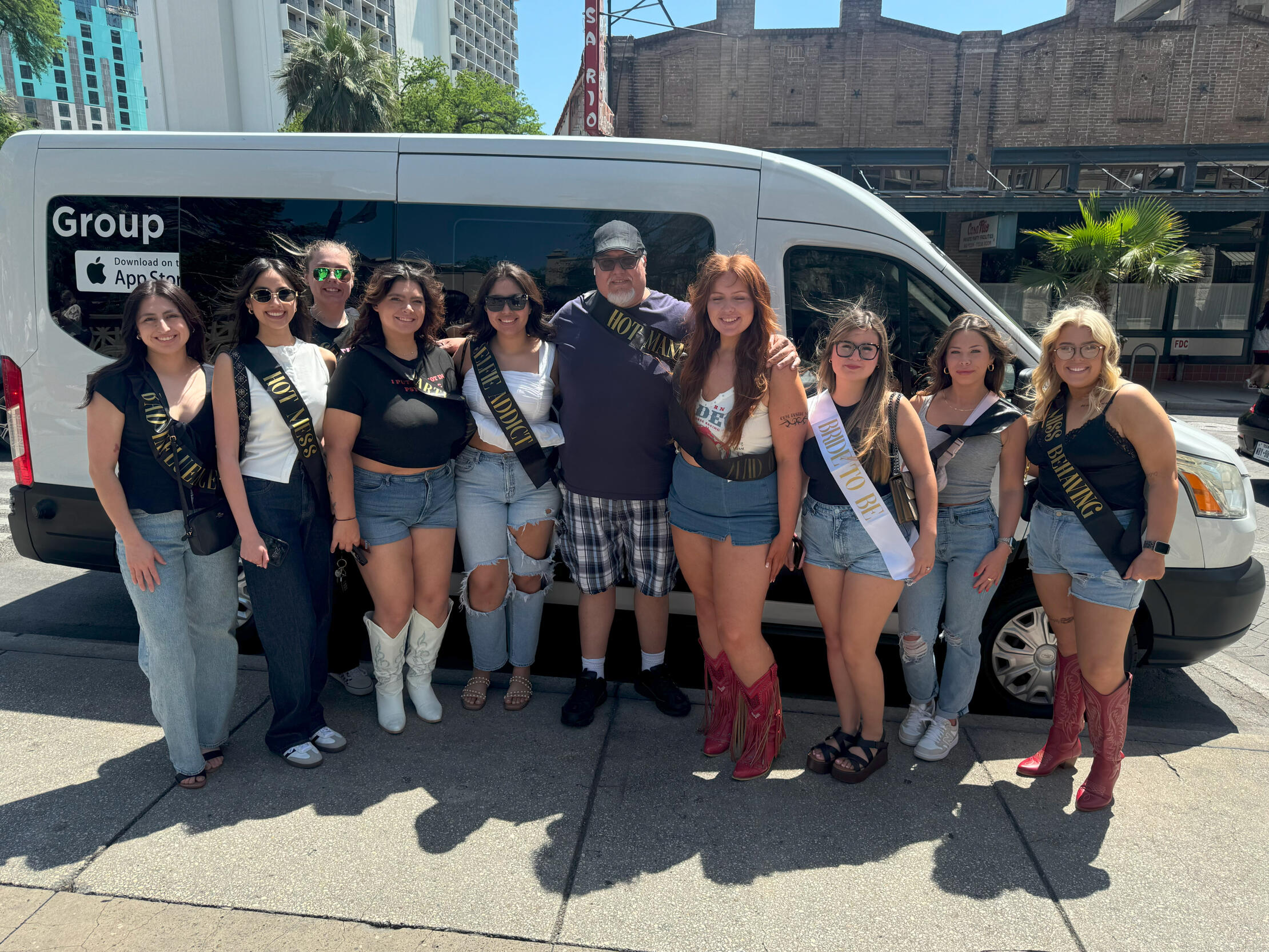 Bridal Shower in front of a White Ford Transit Van.
